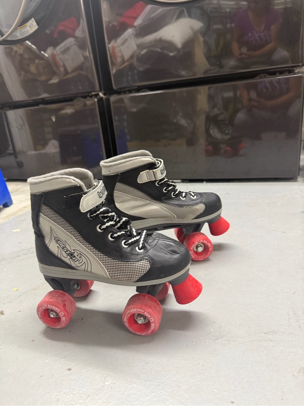 Kids Quad Roller Skates in Black and Gray with Red Wheels